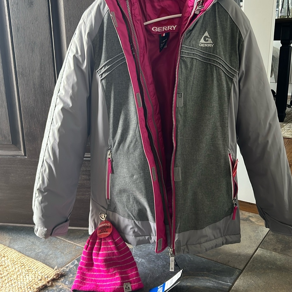 GERRY winter jacket. Gray outer color, pink inside jacket.Size 14/16 girls.